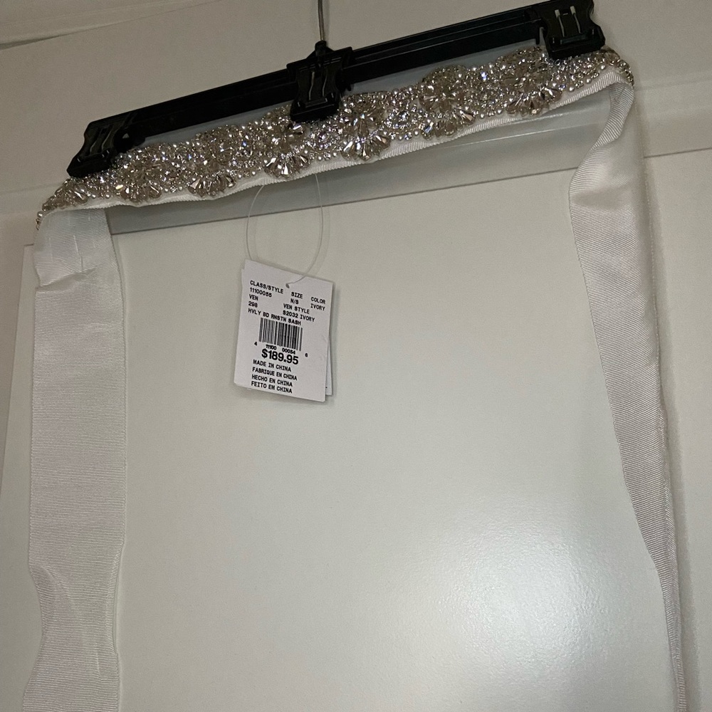 Wedding dress with sash and veil. Brand new with tags.